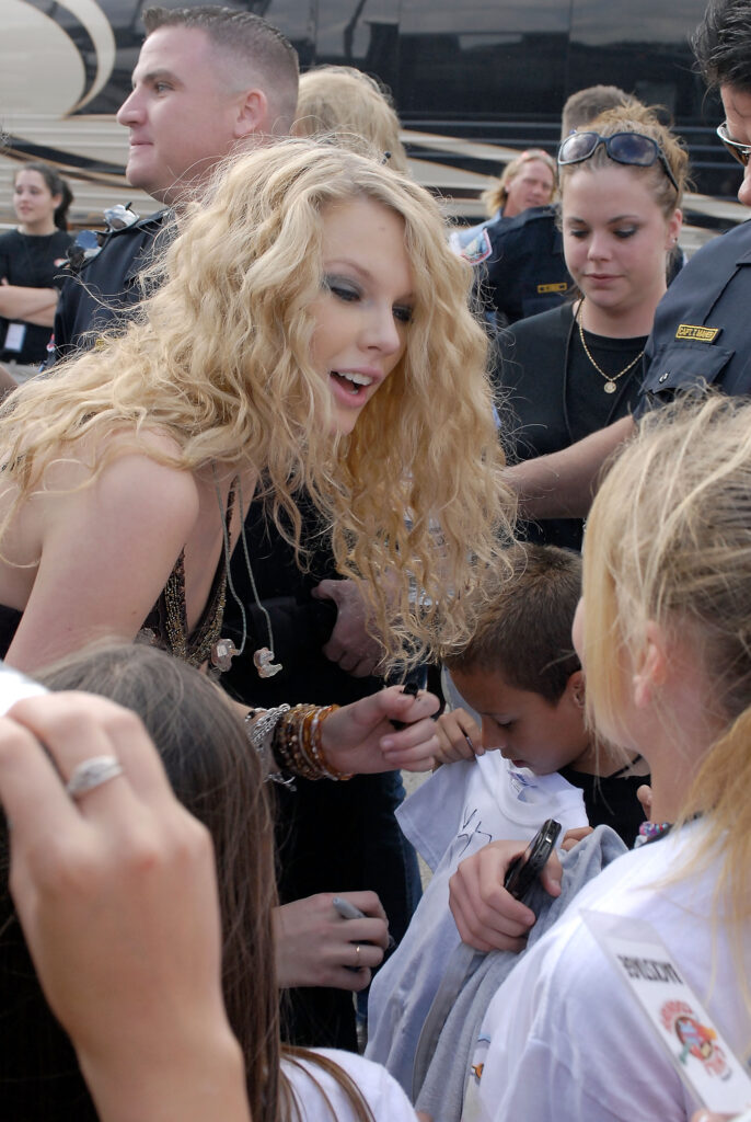 Taylor Swift performs live earlier in her career at KISS Country Chili Cookoff 2008 in Pembroke Pines Florida
