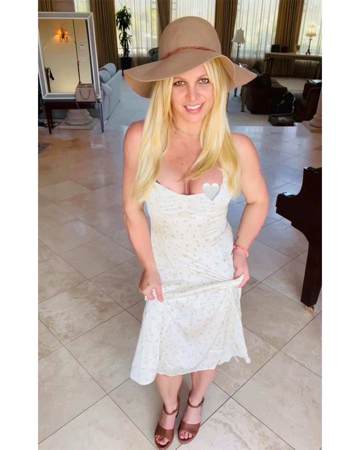 Britney Spears Suffers A Nip Slip In White Floral Dress