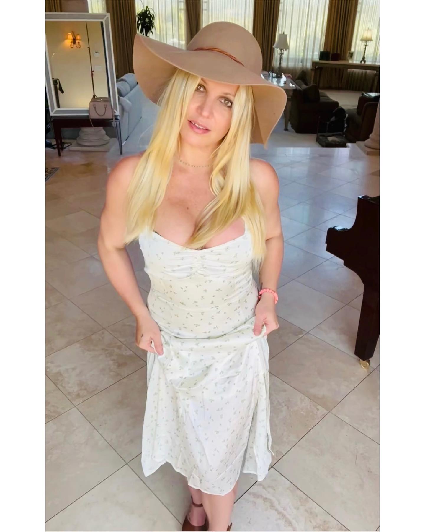 Britney Spears Suffers A Nip Slip In White Floral Dress