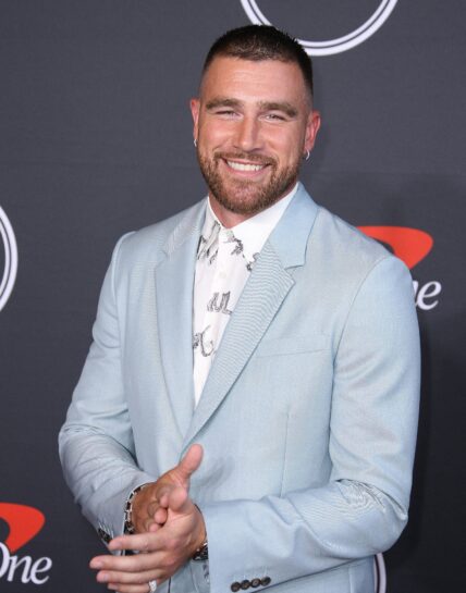 Travis Kelce smiling on the red carpet