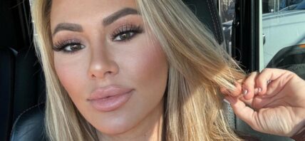 Kindly Myers sitting in traffic