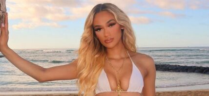 Savannah Tucker poses for the camera in her bikini and jeans while at the beach.