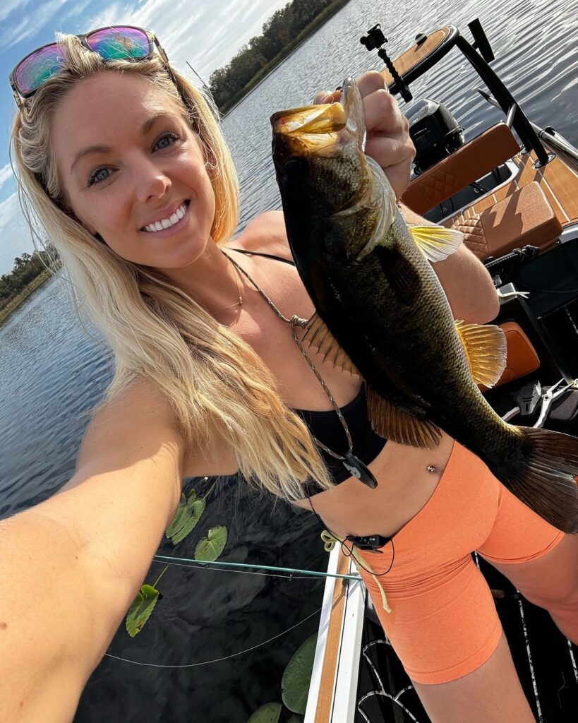 Florida angler Erica Lynn takes a selfie in her bikini while showing off her big catch of the day.