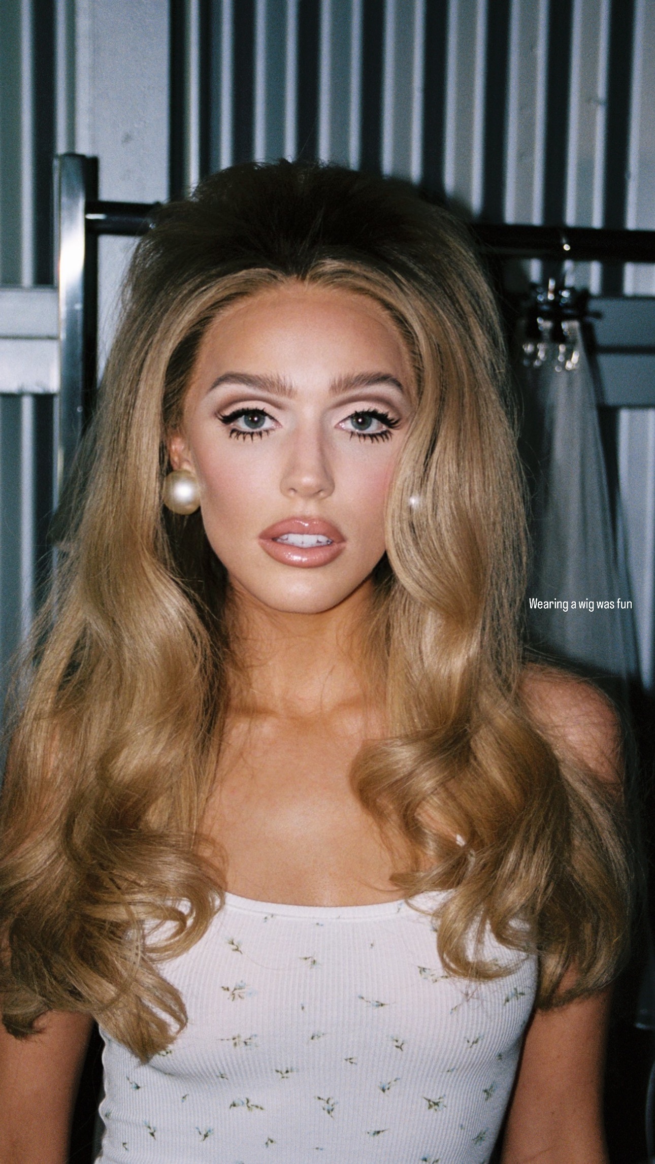 Alex Cooper poses for the camera in BTS pics from her SKIMS campaign.