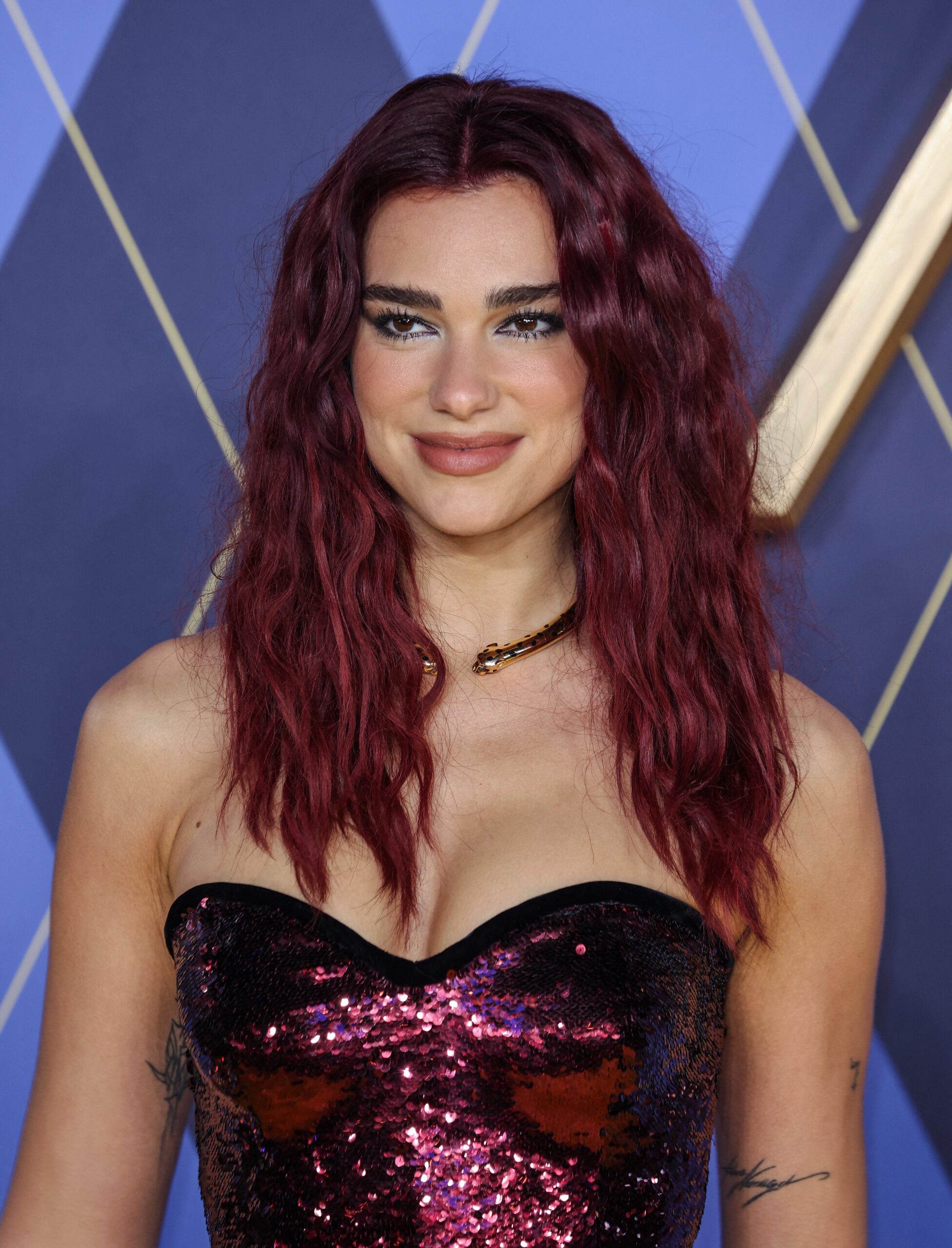 Dua Lipa's Latest Social Post Sparks Speculation: 'Who Wants More?'