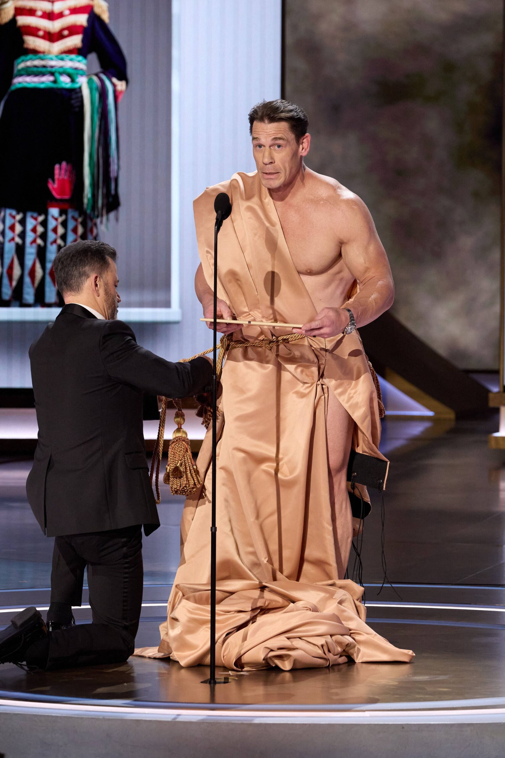March 10, 2024, Hollywood, California, USA: Emily Blunt and Ryan Gosling celebrate stunt performers and stunt coordinators onstage during the live ABC telecast of the 96th Oscars at the Dolby Theatre at Ovation Hollywood on Sunday, March 10, 2024. 10 Mar 2024 Pictured: March 10, 2024, Hollywood, California, USA: Jimmy Kimmel and John Cena present the Oscar for Costume Design during the live ABC telecast of the 96th Oscars at the Dolby Theatre at Ovation Hollywood on Sunday, March 10, 2024. Photo credit: ZUMAPRESS.com / MEGA TheMegaAgency.com +1 888 505 6342 (Mega Agency TagID: MEGA1109160_030.jpg) [Photo via Mega Agency]