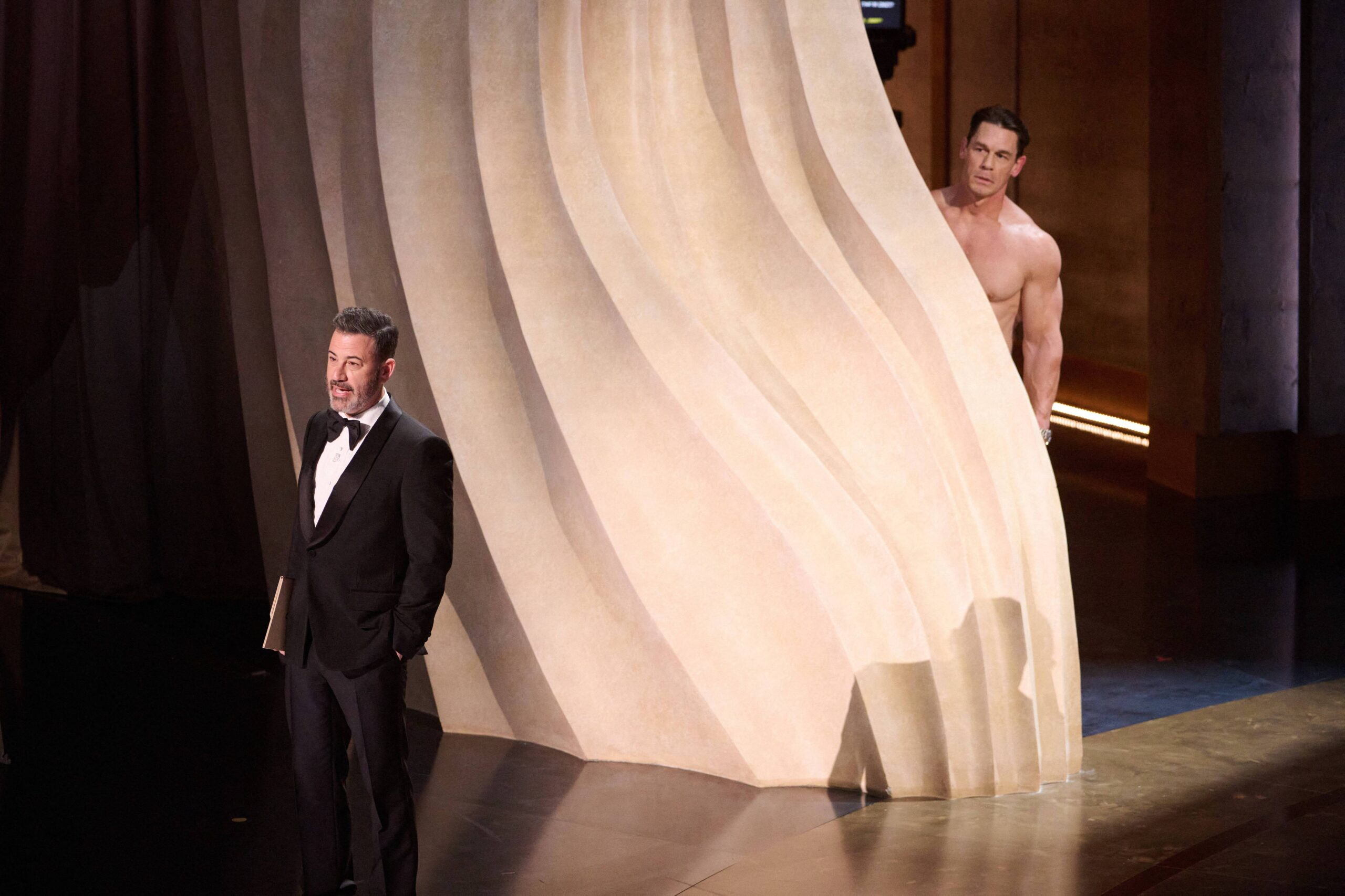March 10, 2024, Hollywood, California, USA: John Cena and Jimmy Kimmel present the Oscar for Costume Design during the live ABC telecast of the 96th Oscars at the Dolby Theatre at Ovation Hollywood on Sunday, March 10, 2024. 10 Mar 2024 Pictured: March 10, 2024, Hollywood, California, USA: Jimmy Kimmel and John Cena present the Oscar for Costume Design during the live ABC telecast of the 96th Oscars at the Dolby Theatre at Ovation Hollywood on Sunday, March 10, 2024. Photo credit: ZUMAPRESS.com / MEGA TheMegaAgency.com +1 888 505 6342 (Mega Agency TagID: MEGA1109164_023.jpg) [Photo via Mega Agency]