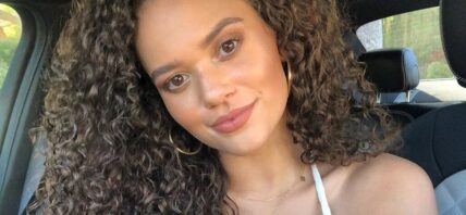 Madison Pettis smiles to the camera.