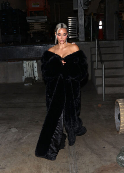 Kim Kardashian stunned in a black Faux Fur coat showing off her new platinum blonde hair at the Homeboy Industries Gala where she was honored