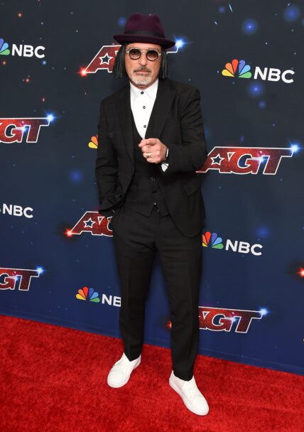 Howie Mandel poses on the red carpet at America's Got Talent Season 18 Live Show