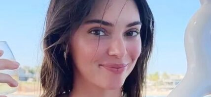 Kendall Jenner smiles outdoors