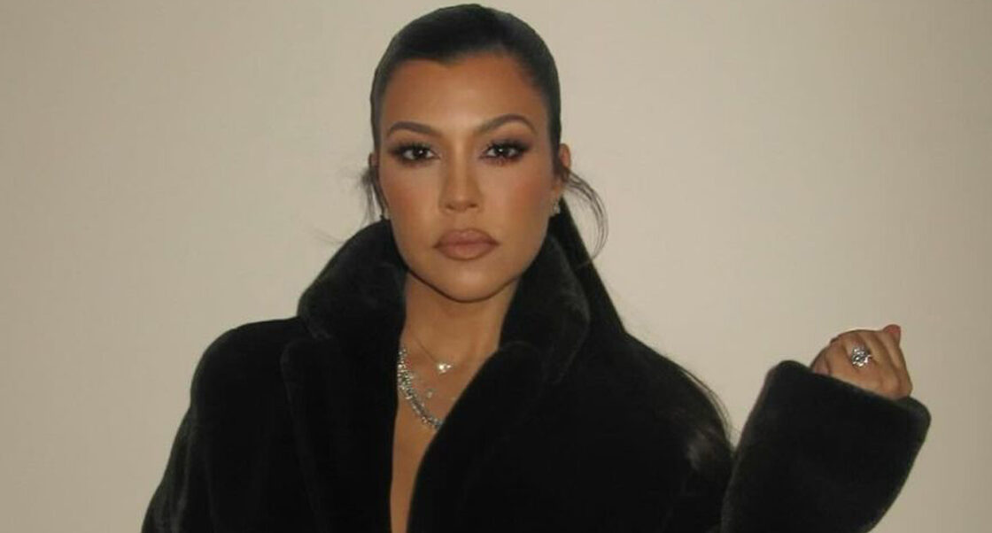 Kourtney Kardashian photographed wearing a black robe after the birth of son Rocky.