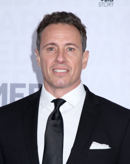 Chris Cuomo smiles in a black tux
