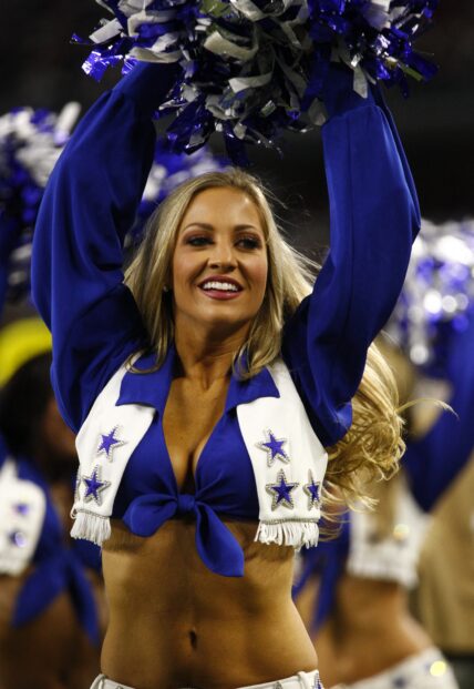 The Dallas Cowboys Cheerleaders perform as The Dallas Cowboys vs the Washington Redskins game