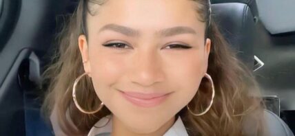 Zendaya smiling from her car