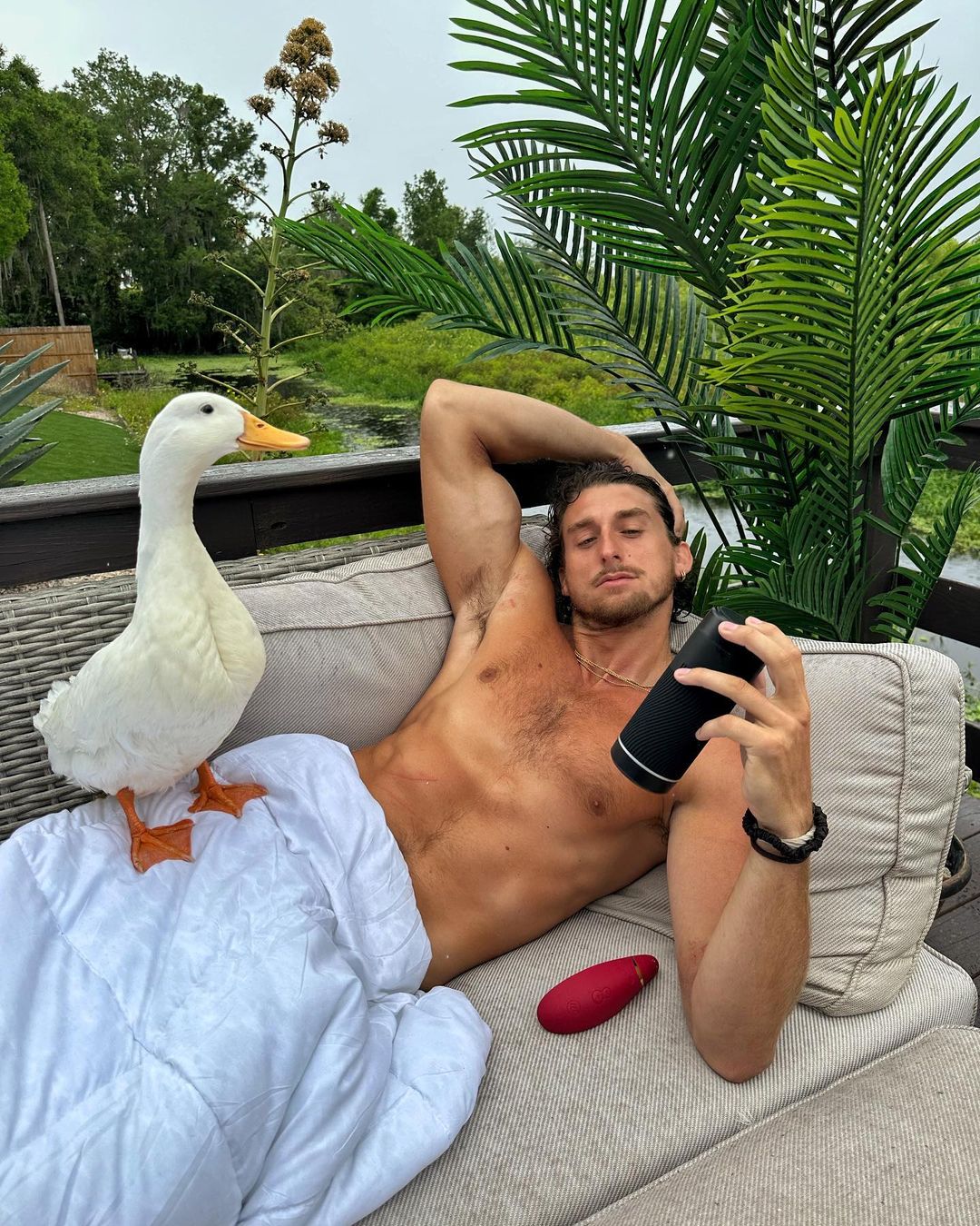 TooTurntTony laying down with his pet duck