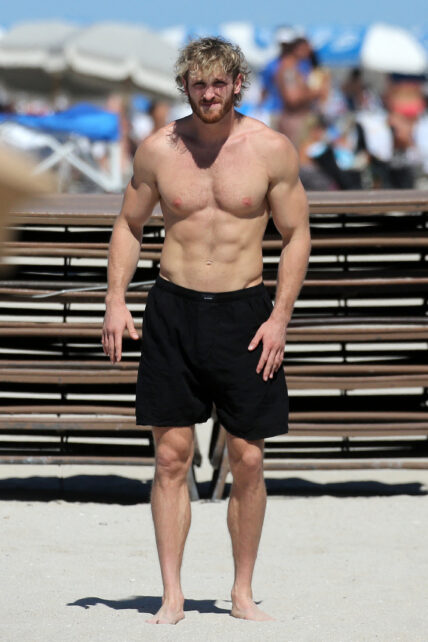 Logan Paul shows off his muscular physique as he hits the beach with bikini-clad girlfriend Nina Agdal in Miami. 23 Oct 2022 Pictured: Logan Paul; Nina Agdal. Photo credit: MEGA TheMegaAgency.com +1 888 505 6342 (Mega Agency TagID: MEGA910542_002.jpg) [Photo via Mega Agency]