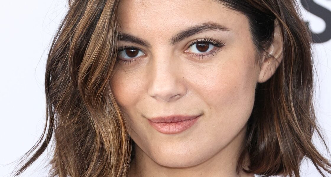 Monica Barbaro Smiling In Plunging Bikini Questioned Over Her ‘Implants’