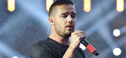 Liam Payne singing on stage