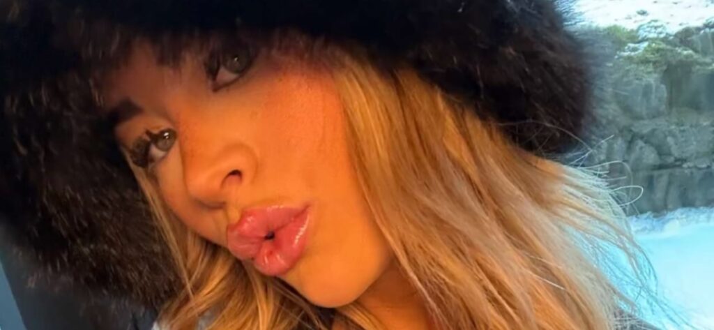 Emily Elizabeth Teases Sun-Kissed Glow In White Bikini Photos