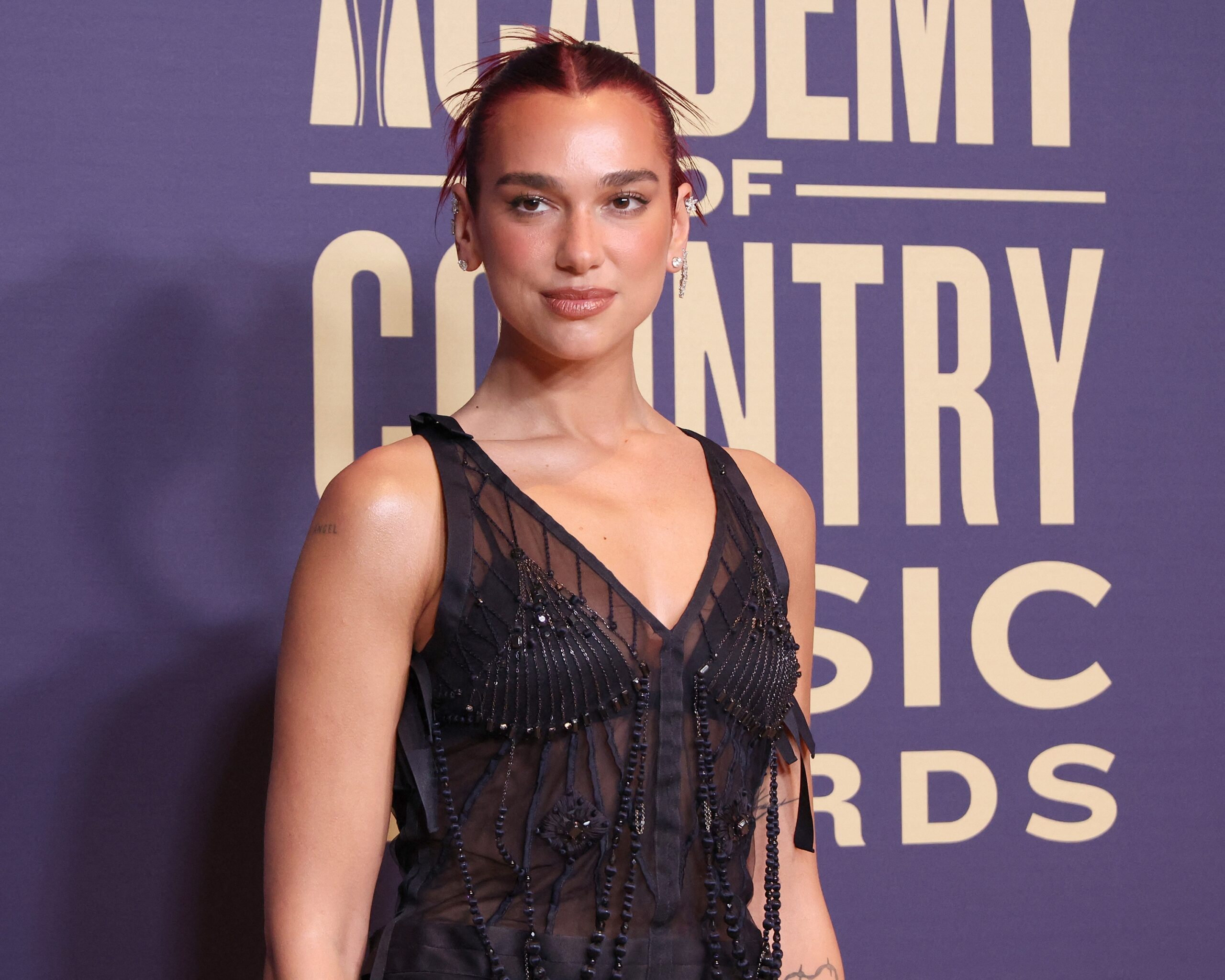 Dua Lipa Declares Lingerie Party-Appropriate In Lace Suspenders