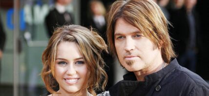 Miley Cyrus and Billy Ray Cyrus smiling