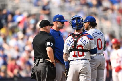 Chicago Cubs coach David Ross speaks to players during the 2023 MLB London Series