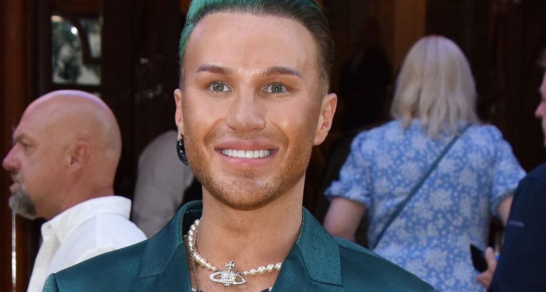 The Vivienne poses out of drag.