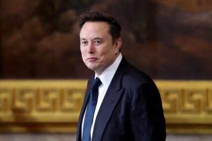 Elon Musk in a suit