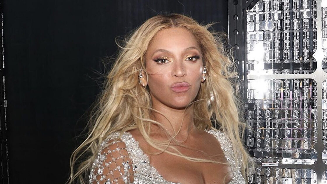 Beyoncé posing in silver behind the scenes of the RENAISSANCE World Tour.