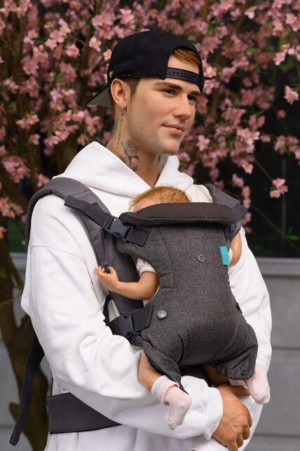 Justin Bieber carrying his baby