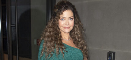 Denise Richards rocks a green one shouldered dress as she exits studios in NYC