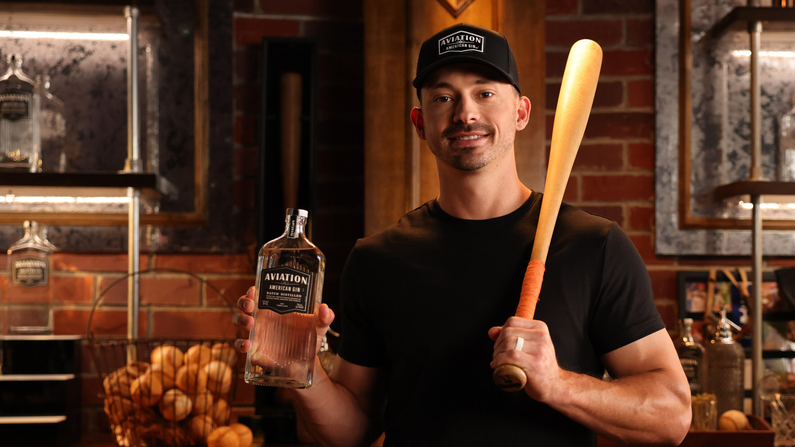 Bryan Reynolds holding a bottle of gin