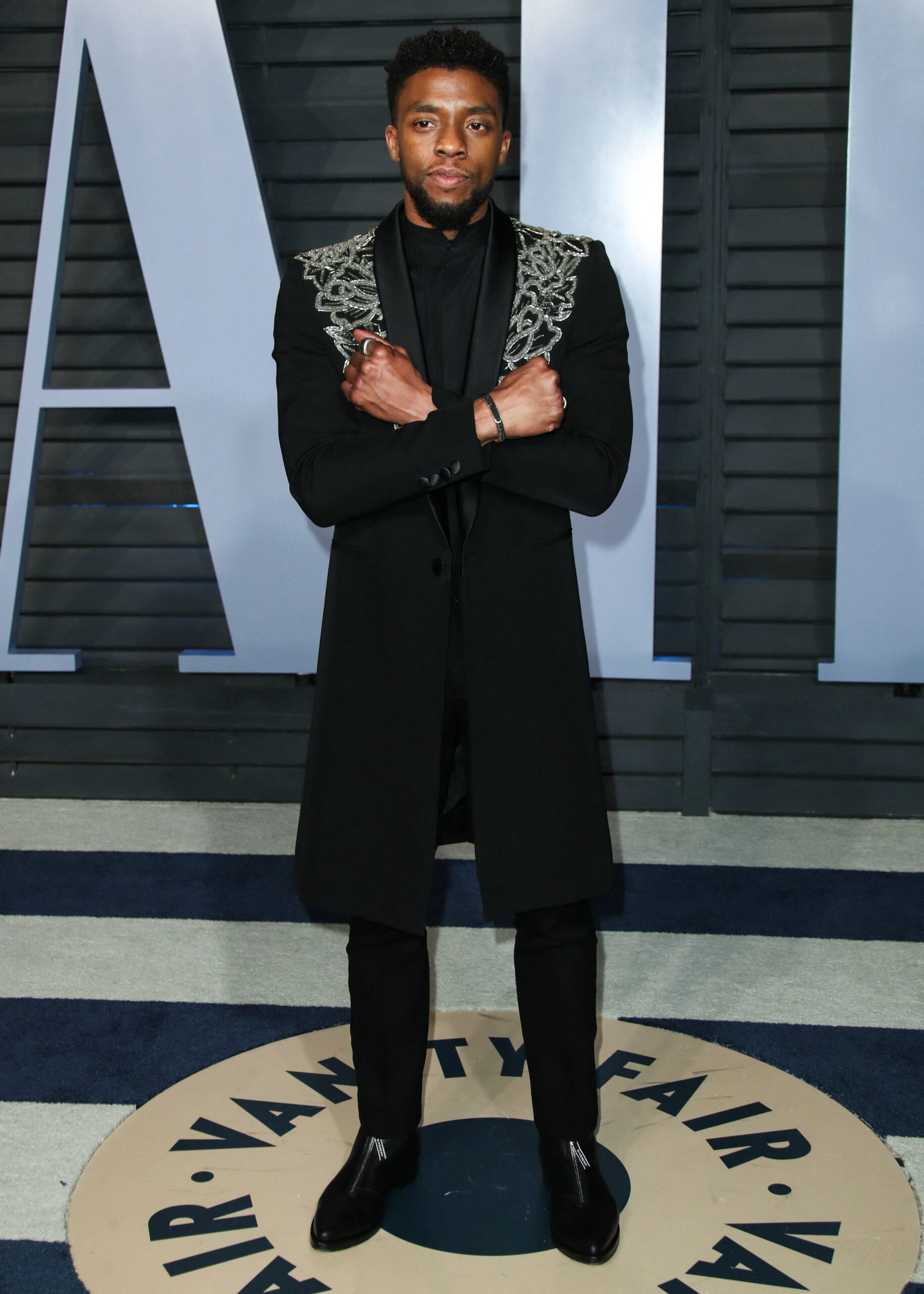 Chadwick Boseman flashing Wakanda Forever