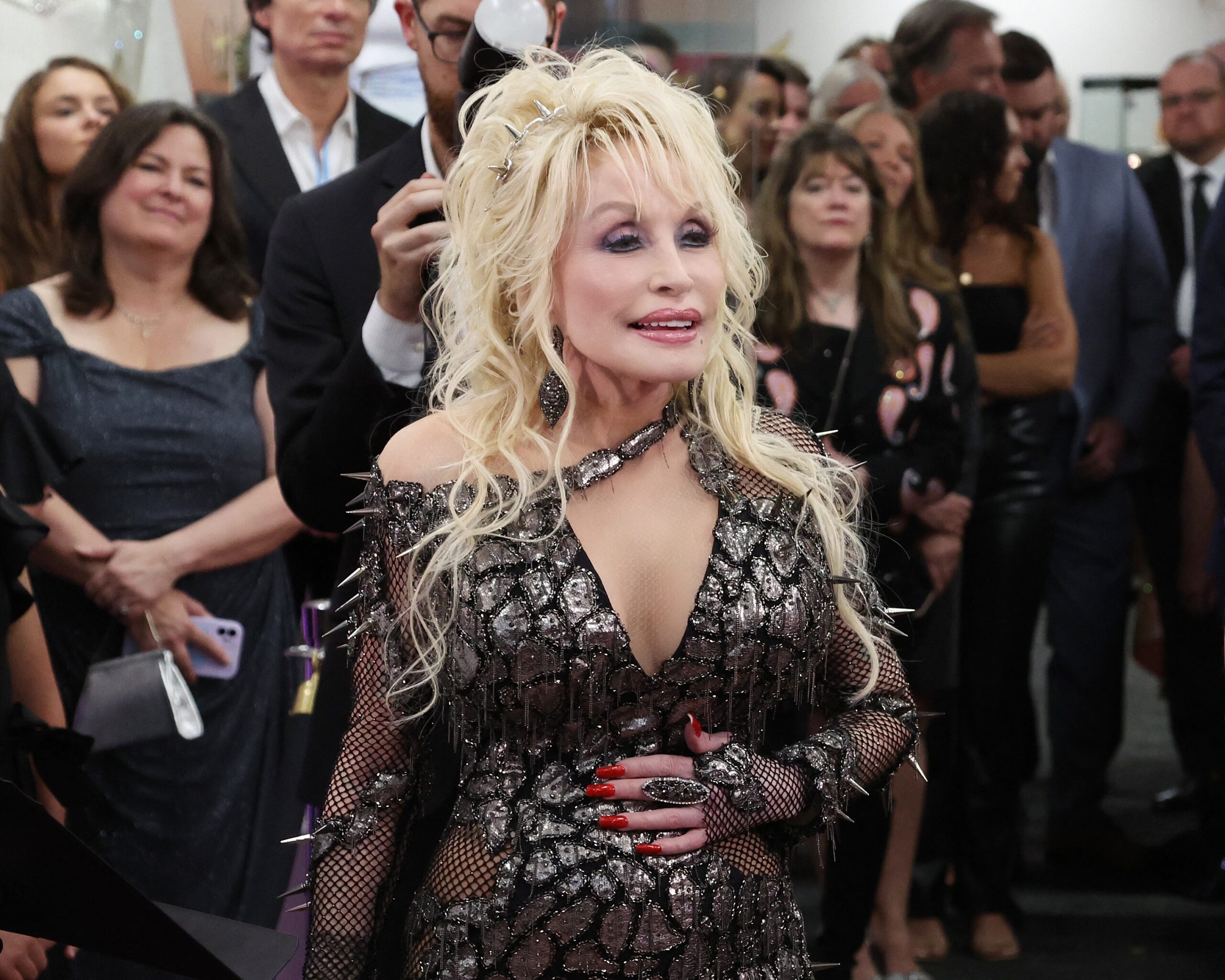 Dolly Parton at the ribbon cutting ceremony for the gallery exhibition of Dolly Parton and the Makers