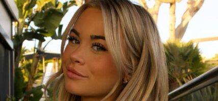 Emily Elizabeth smiles at the camera.