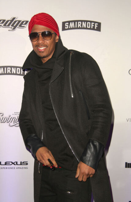 Nick Cannon posing on the red carpet.