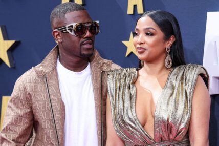 Ray J and Princess Love posing together on the red carpet during the BET Awards.