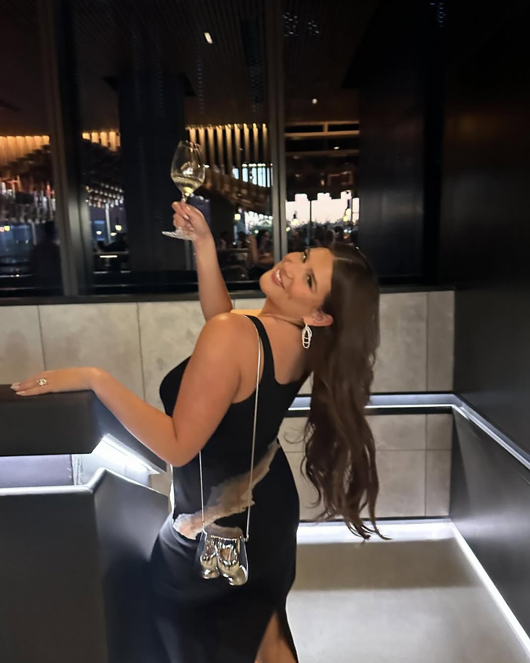 Remi Bader sipping wine