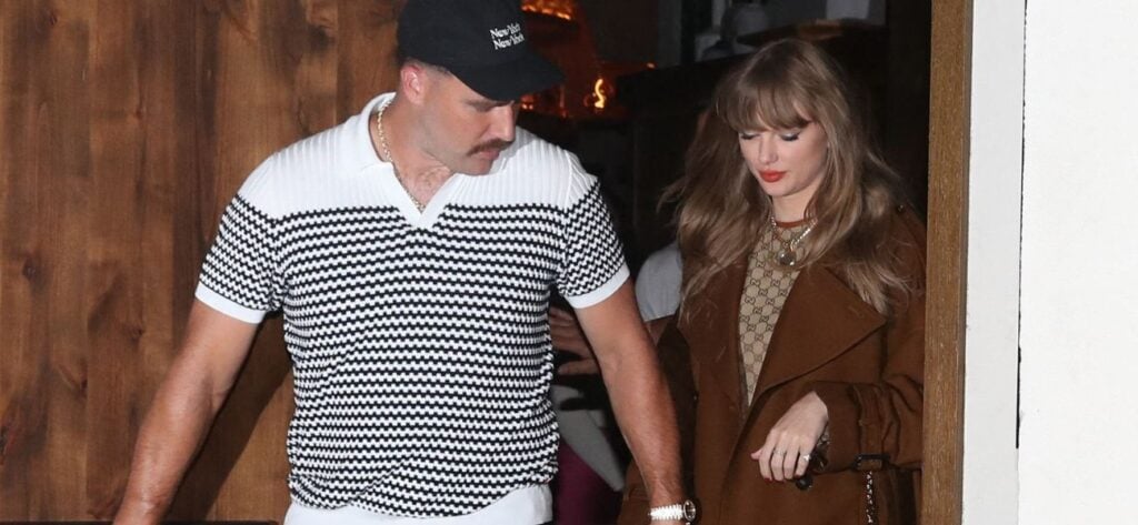 Taylor Swift and Travis Kelce holding hands