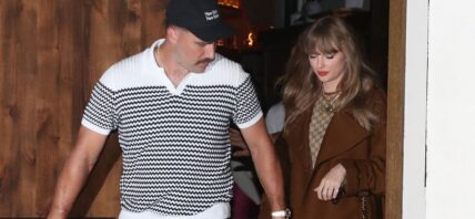 Taylor Swift and Travis Kelce holding hands