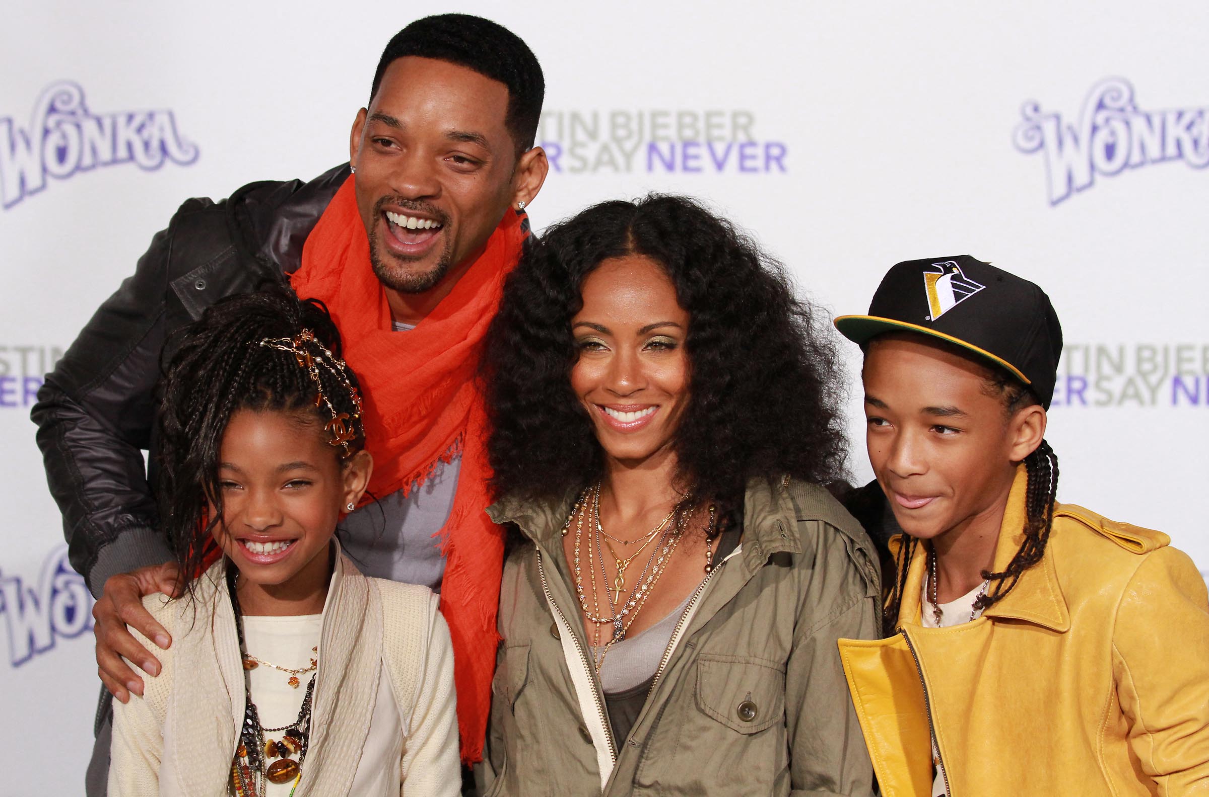 Will Smith, Willow Smith, Jada Pinkett Smith, and Jaden Smith posing on the red carpet. 