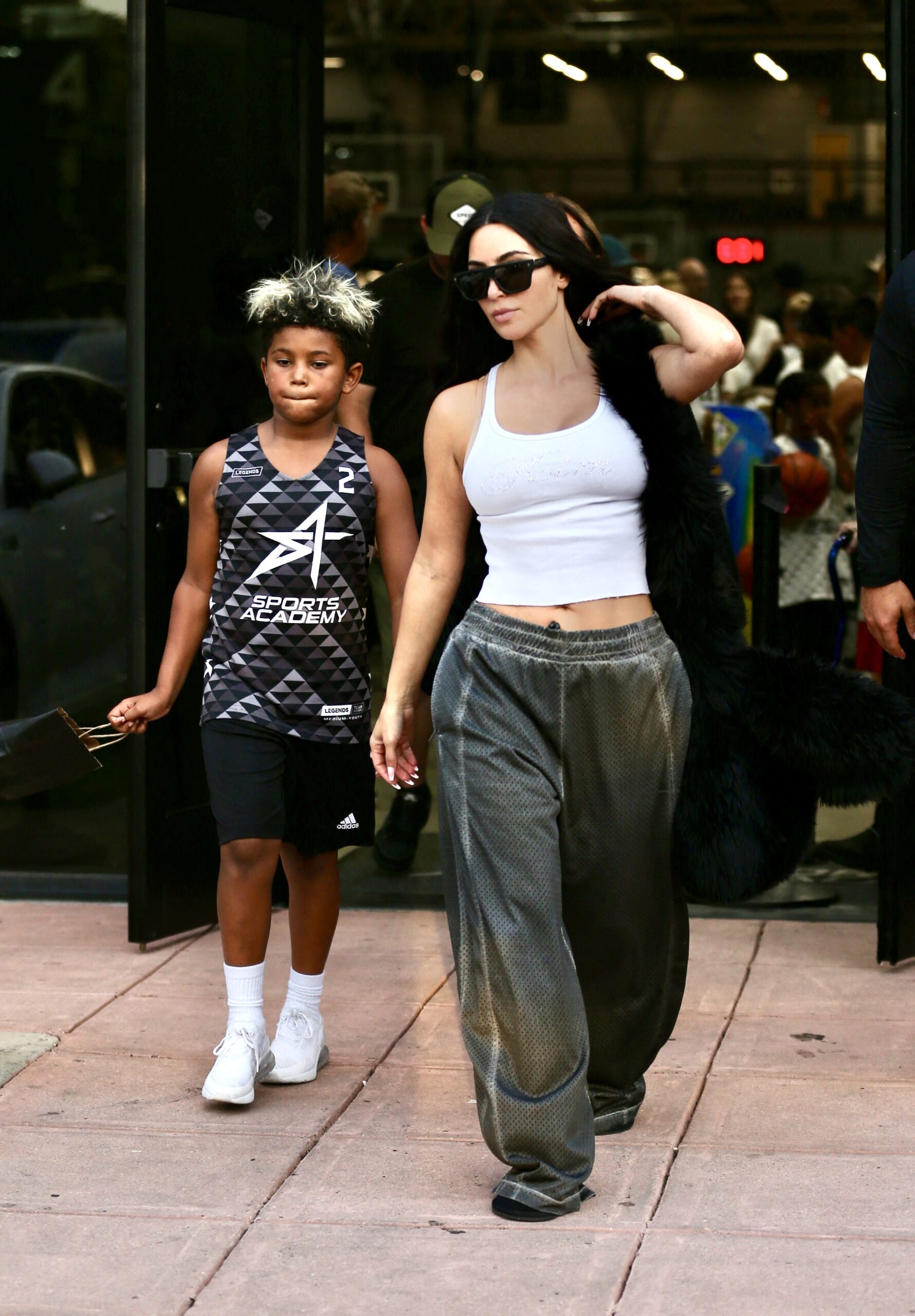 Kim Kardashian is seen with her son Saint West as they leave his basketball game