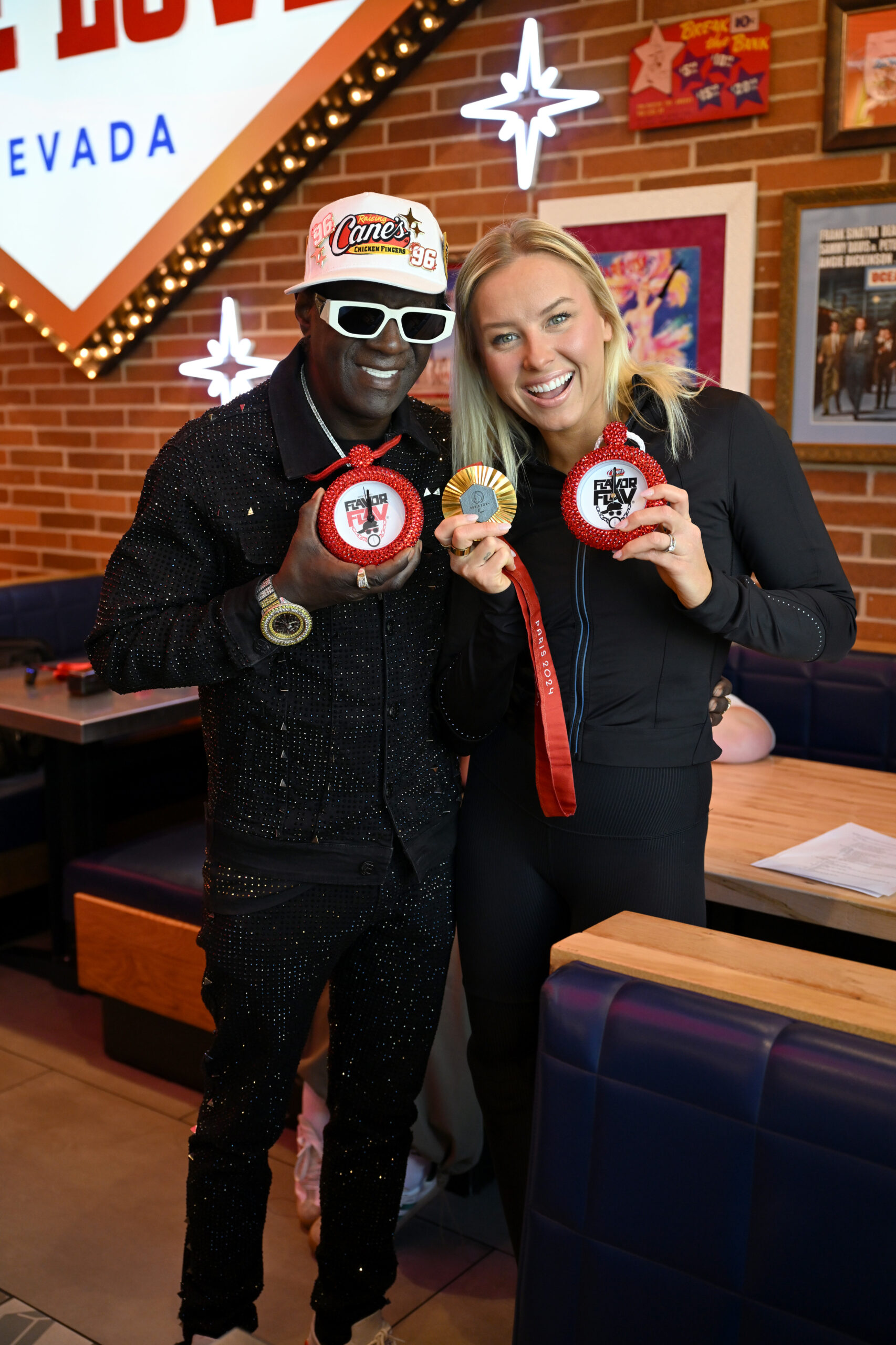 Pop Culture Icon Flavor Flav Works "Shift" at Raising Cane's Las Vegas Ahead of Cane's New "Flavor Fast" Campaign alongside Paralympic swimmer