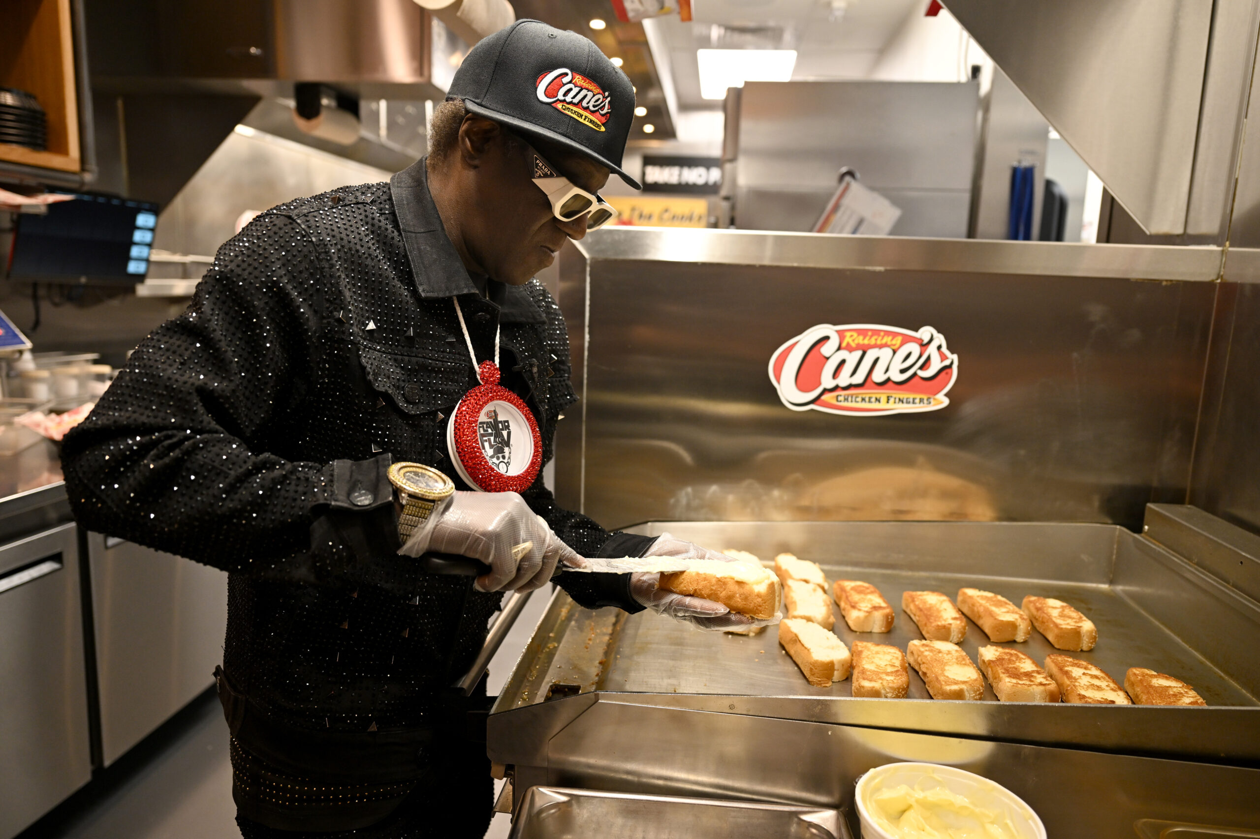 Pop Culture Icon Flavor Flav Works "Shift" at Raising Cane's Las Vegas Ahead of Cane's New "Flavor Fast" Campaign