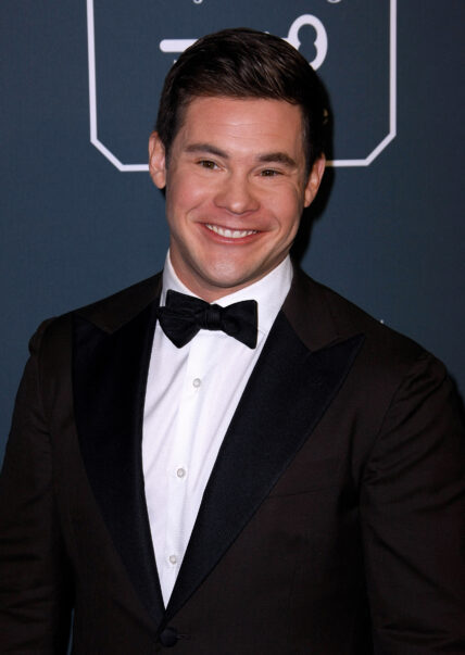 Adam DeVine posing on the red carpet.