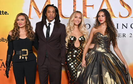 Beyoncé, Jay-Z, Tina Knowles, and Blue Ivy Carter posing on the red carpet during the "MUFASA" premiere.