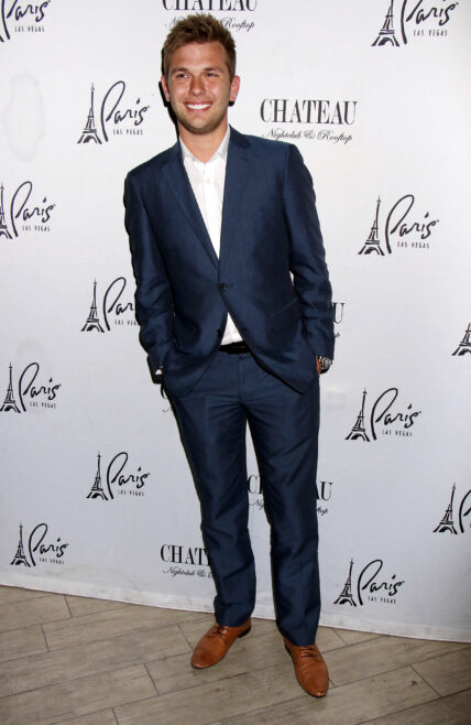 Chase Chrisley posing on the red carpet.