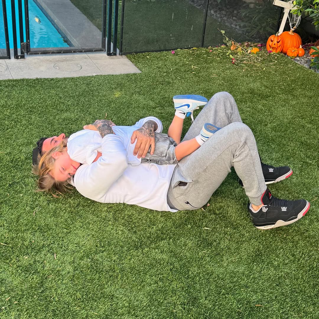 Jax Taylor playing with his son in his yard.
