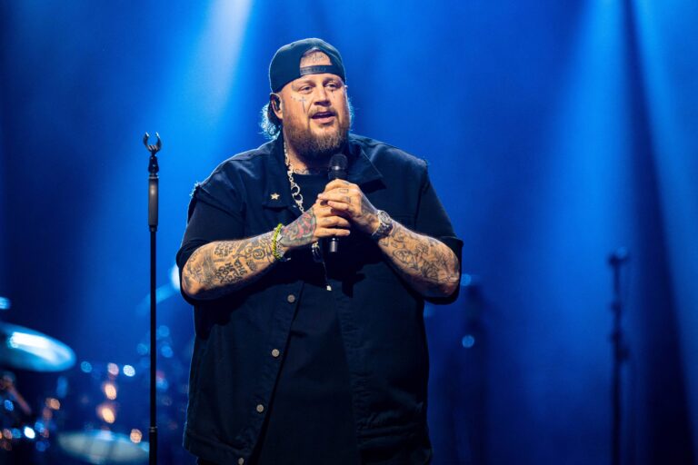 Jelly Roll holding a microphone